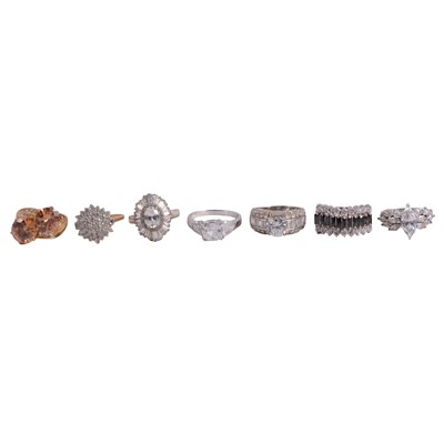 Lot 132 - Seven dress rings set with cubic zirconia.
