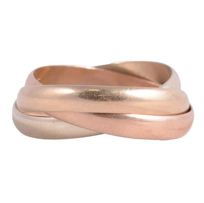 Lot 160 - A Russian style 9 carat tri-colour gold wedding ring.