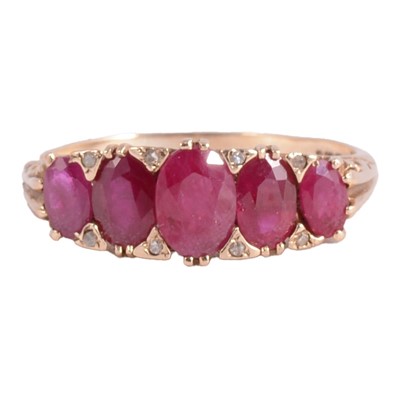 Lot 18 - A ruby and diamond ring.