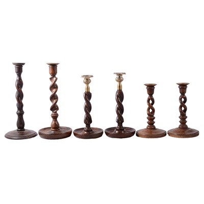 Lot 91 - Collection of oak and other barleytwist candlesticks
