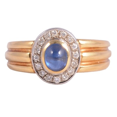 Lot 45 - A sapphire and diamond cluster ring.