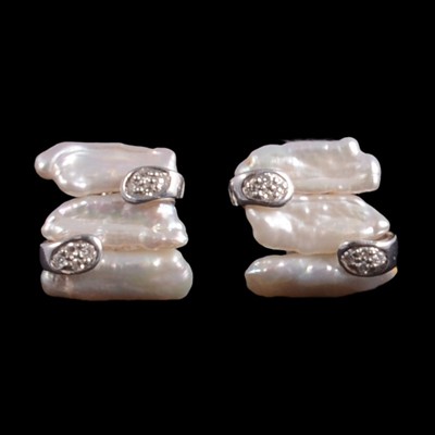 Lot 256 - A pair of baroque pearl and diamond earrings.