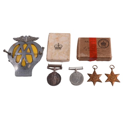 Lot 278 - Four military service medals and an AA car badge