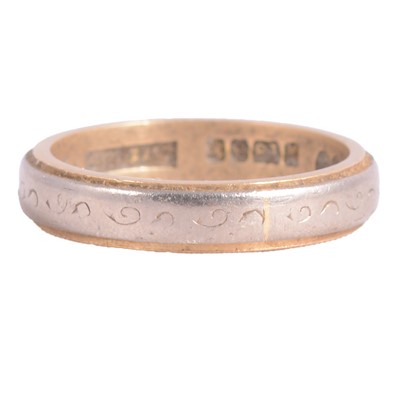 Lot 186 - An 18 carat yellow and white gold wedding band.
