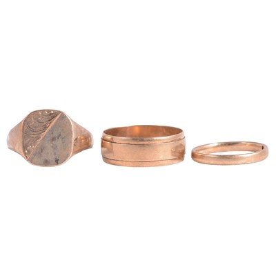 Lot 181 - Two 9 carat yellow gold wedding bands, and a 9 carat yellow gold signet ring.