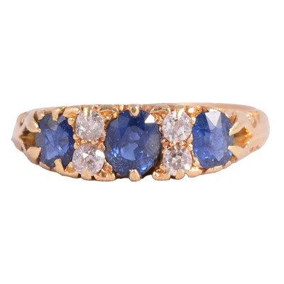 Lot 56 - A sapphire and diamond ring.
