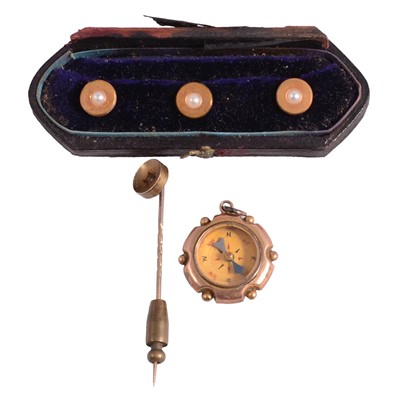 Lot 473 - A small yellow metal compass, diamond stick pin, and set of three yellow metal dress studs.