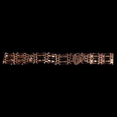 Lot 303 - A 9 carat yellow gold five bar gate link bracelet.
