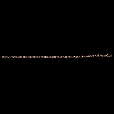 Lot 287 - A ruby and diamond line bracelet.