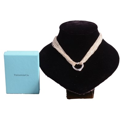 Lot 1188 - Elsa Peretti for Tiffany - an open heart pendant and multi strand necklace.