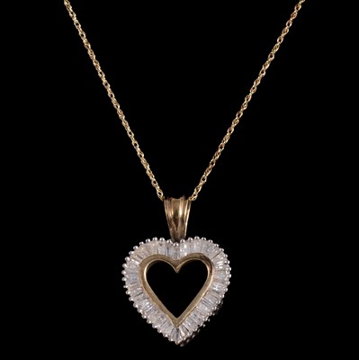 Lot 320 - A diamond heart pendant.