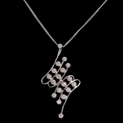 Lot 399 - A diamond zigzag pendant.