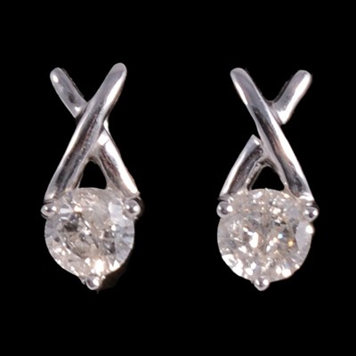 Lot 427 - A pair of diamond earstuds.