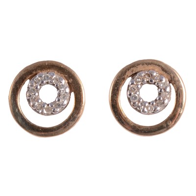 Lot 431 - A pair of circular gold earrings with diamond centre.
