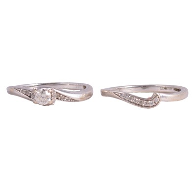 Lot 58 - A diamond solitaire ring, and a diamond curved ring to match.