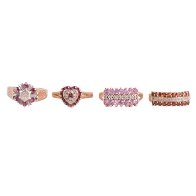 Lot 34 - Four gemset rings, ruby and diamond, garnet and diamond, and another.