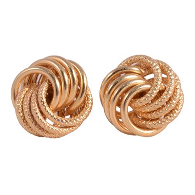 Lot 448 - A pair of yellow metal knot earrings.