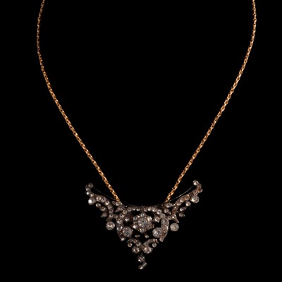 Lot 355 - A paste set pendant conversion on a yellow metal chain.