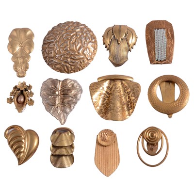 Lot 1172 - Twelve 1930's gilt metal dress clips.