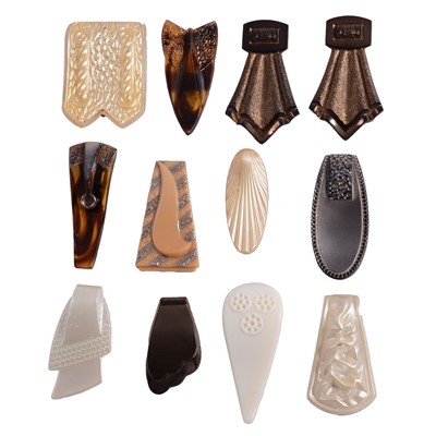 Lot 1171 - Twelve vintage pressed glass single dress clips.