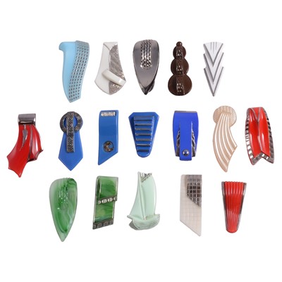 Lot 1170 - Seventeen Art Deco colourful pressed glass single dress clips.
