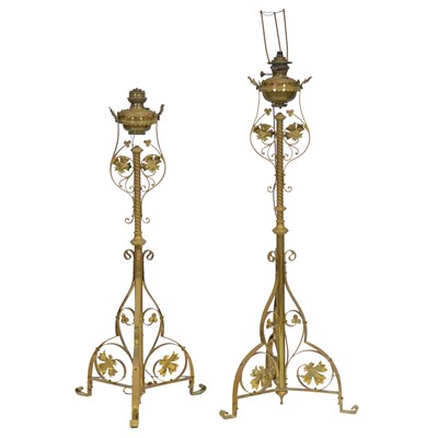 Lot 377 - Two Victorian brass Arts & Crafts standard lamps