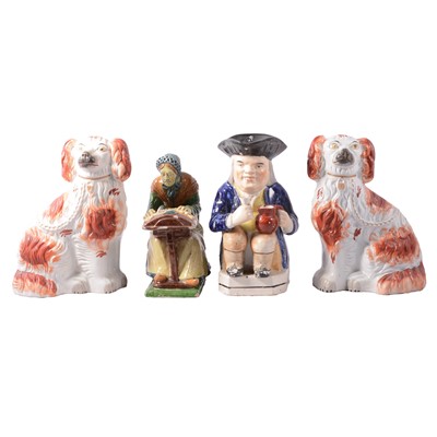Lot 49 - Flemish pottery figure of an old lacemaker, a large Toby jug, and pair of King Charles Spaniels