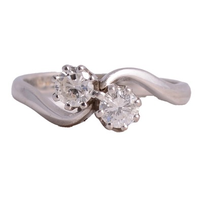 Lot 46 - A diamond two stone crossover ring.
