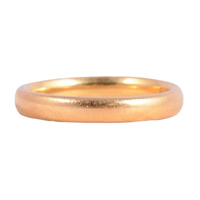 Lot 114 - A 22 carat gold wedding band.