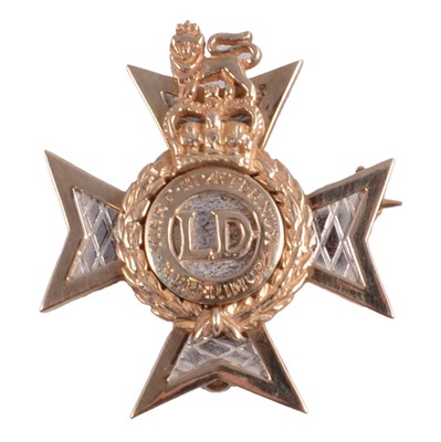 Lot 263 - Military interest; Light Dragoons 9ct gold regimental brooch