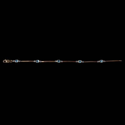Lot 246 - A heat treated blue topaz and diamond bracelet.