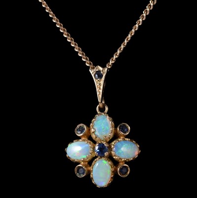 Lot 333 - An opal and sapphire pendant on a chain, and matching earstuds.