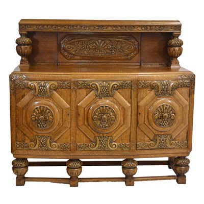 Lot 428 - Arthur Woods of Olney, an oak dining room suite