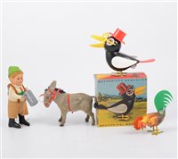 Lot 1214 - Schuco clock work tin-plate toys; Man drinking...