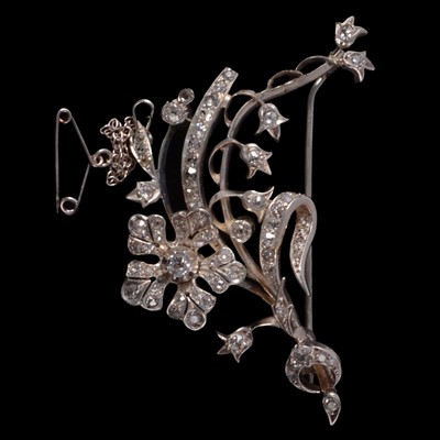 Lot 137 - A diamond set floral spray brooch.
