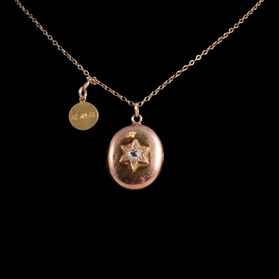 Lot 306 - A yellow metal locket and chain set with a rose cut diamond.