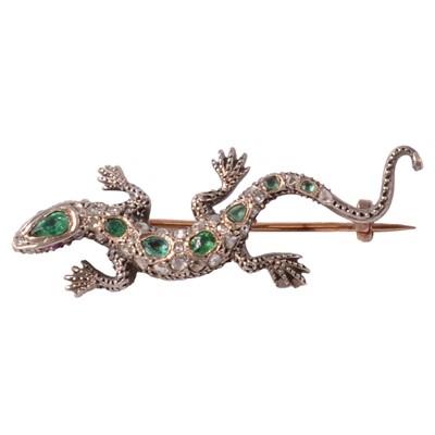 Lot 202 - An emerald, diamond, and ruby set lizard brooch.