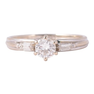 Lot 63 - A diamond three stone ring.