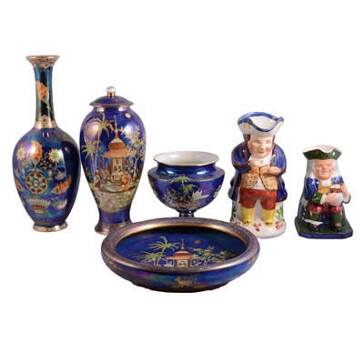 Lot 38 - A collection of Carlton ware blue lustre ceramics and two Toby jugs.