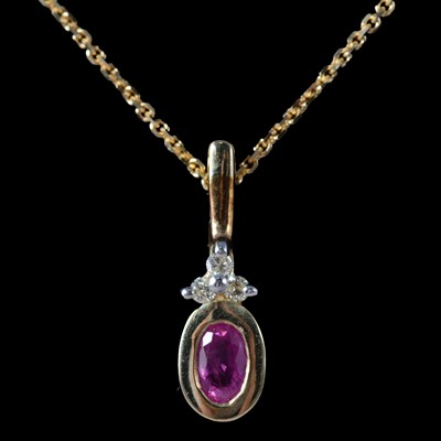 Lot 212 - A ruby and diamond pendant on a chain, with matching earrings.