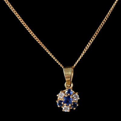 Lot 188 - A sapphire and diamond pendant on a chain.