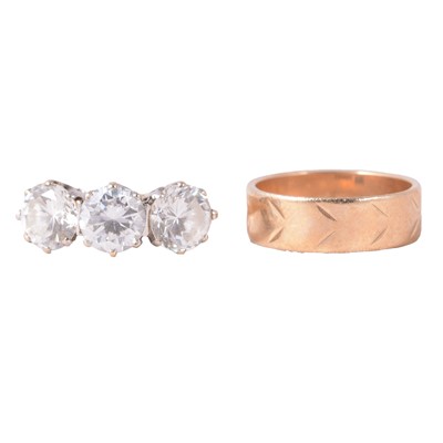 Lot 84 - A synthetic white stone (not diamond) ring, and a 9 carat yellow gold wedding band.