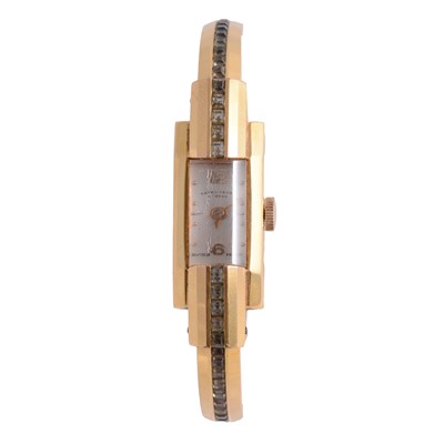 Lot 472 - Favre-Leuba - a lady's vintage gold-plated paste set manual wind bangle wristwatch.