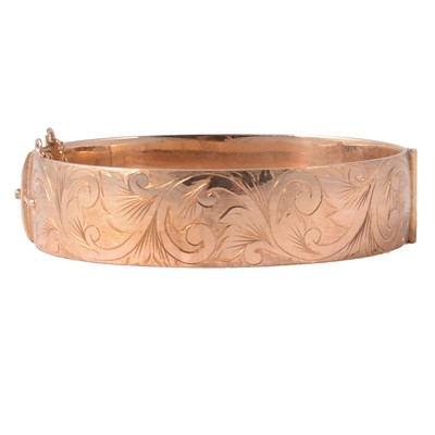 Lot 232 - A 9 carat yellow gold solid half hinged Victorian style bangle.