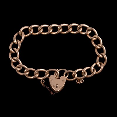 Lot 259 - A 9 carat yellow gold curb link bracelet with padlock fastener.