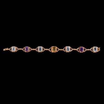 Lot 243 - A yellow metal gemset bracelet marked 18K.