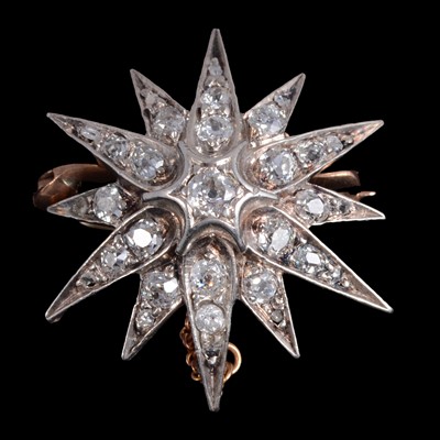 Lot 197 - A diamond star brooch.