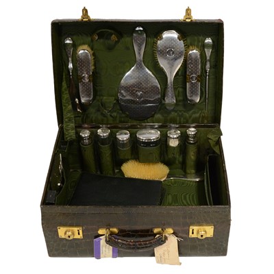 Lot 360A - Ladies' crocodile leather dressing travel case with silver-backed brush and bottle set