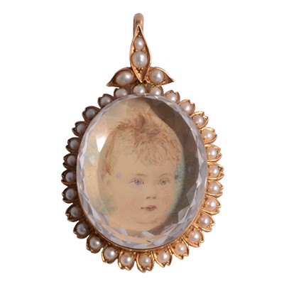 Lot 308 - A yellow metal pendant with a rock crystal over portrait centre.