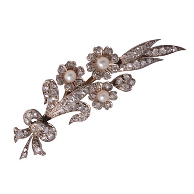 Lot 134 - A diamond and pearl floral spray brooch.